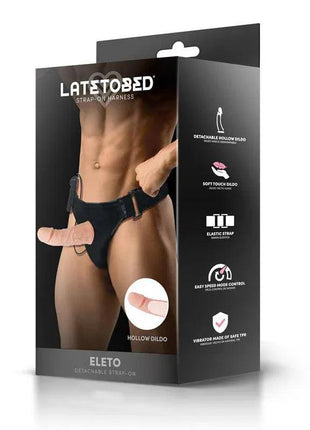 Eleto Detachable Strap-On harness in black, with elastic straps, a flesh-toned hollow dildo and remote control.