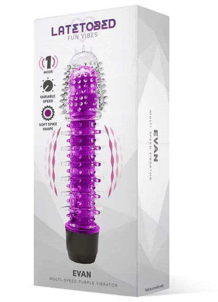Evan Multi-Speed Vibe Purple vibrator with a glossy purple ridged body, raised textured bumps, and a black base, shown in its box