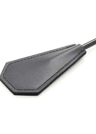 Feather Tickler and Paddle with a black smooth paddle head, stitched edging and a long slender handle