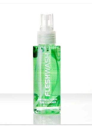 Fleshlight Toy Cleaner in a clear green spray bottle with white pump, antibacterial label and 100 ml capacity