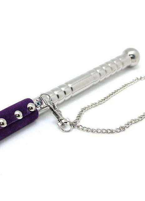 Flogger Purple 52 cm with purple faux leather tails, a silver studded handle, metal clasp and wrist chain