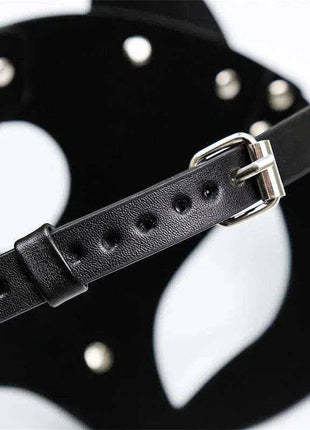 Foxssy Mask Adjustable shown as a black leather strap with punched adjustment holes and a silver metal buckle