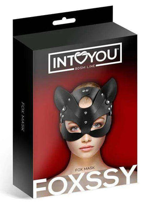 Foxssy Mask Adjustable is a black faux-leather fox mask with pointed ears, eye openings and silver-tone studs, shown on retail packaging.