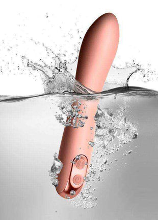 Giamo Vibe Baby Pink vibrator in smooth pink silicone, featuring a curved shape and round control buttons, shown waterproof