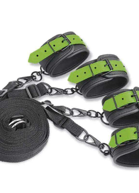 Glow in the Dark Cuffs set with four black cuffs, bright green adjustable straps, metal clips and a coiled black restraint strap