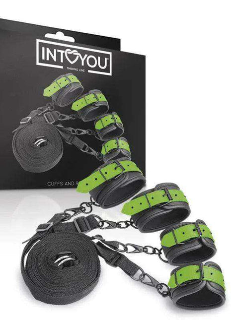Glow in the Dark Cuffs set with bright green adjustable straps, black padded cuffs, chains and restraint tape