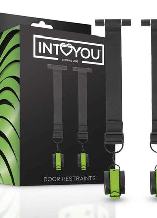 Glow in the Dark Door Restraints with black adjustable straps, metal rings and bright green cuffs in branded packaging