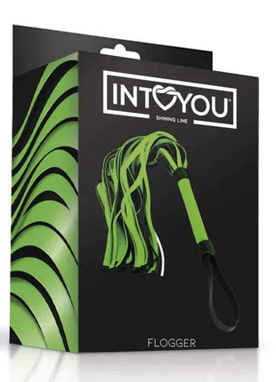 Glow in the Dark Flogger with bright green and black tails and a matching handle, shown on its black retail box