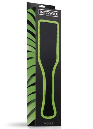 Glow in the Dark Paddle with a black surface, bright green edging and a slim waisted shape, shown in retail packaging