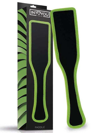 Glow in the Dark Paddle with a black soft-touch surface and vivid green edging, shown beside its matching package.