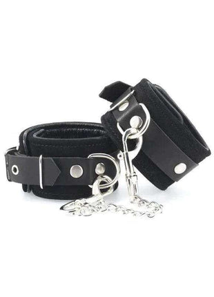 Hand Cuffs-Adjustable black leather wrist cuffs with silver metal studs, rings and a connecting chain