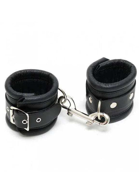 Hand Cuffs LUX 7 CM in black leather with padded cuffs, silver rivets, buckles and a connecting chain
