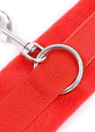 Red handcuffs with soft faux fur lining and secure Velcro closures for comfort and style