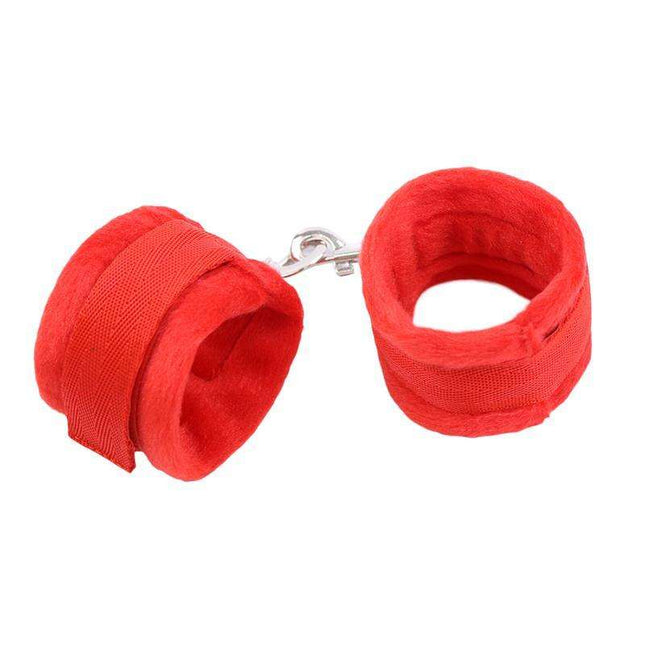 Red handcuffs with soft faux fur lining and velcro closure for comfortable bondage play