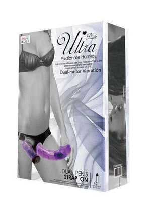 Harness Double Dildo in purple silicone with a curved dual-ended shape and built-in vibration, shown on product packaging