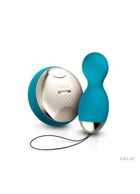 Vibrating pelvic floor trainer in teal blue silicone with a rounded handle, silver control base, and attached cord