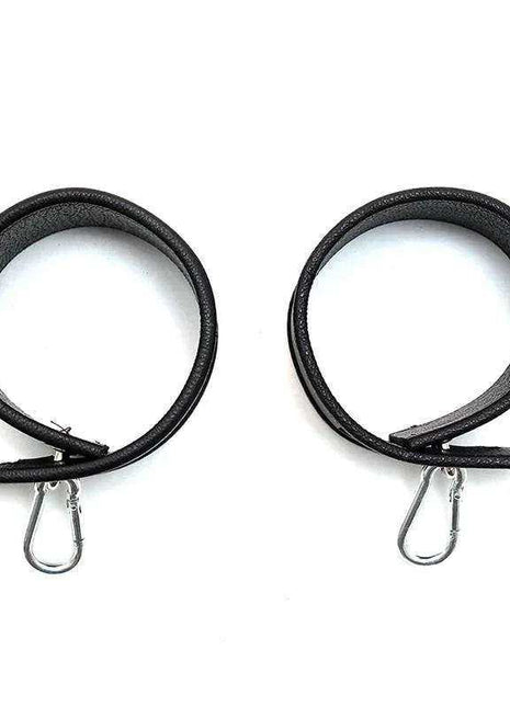 Leather Cuffs-Adjustable in black leather, shown as two looped cuffs with slim metal clasp hardware.