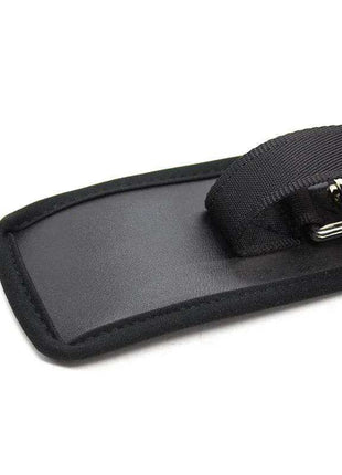 Leather Handcuffs with Big Hoops Black, showing a black padded cuff with a woven strap and shiny metal ring hardware