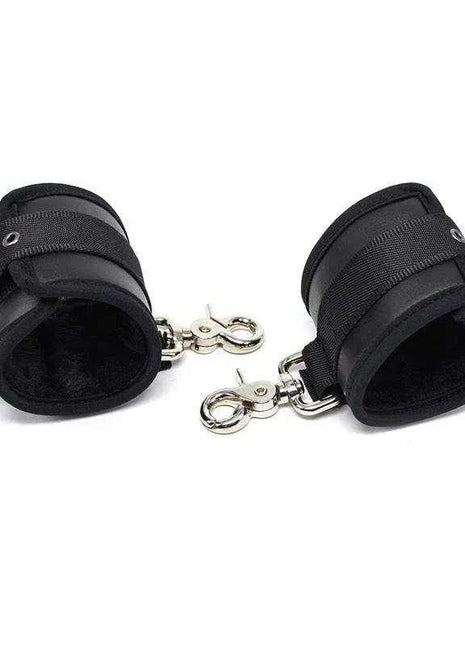 Leather Handcuffs with Big Hoops Black, featuring black padded cuffs, adjustable straps, and shiny metal rings and clips.