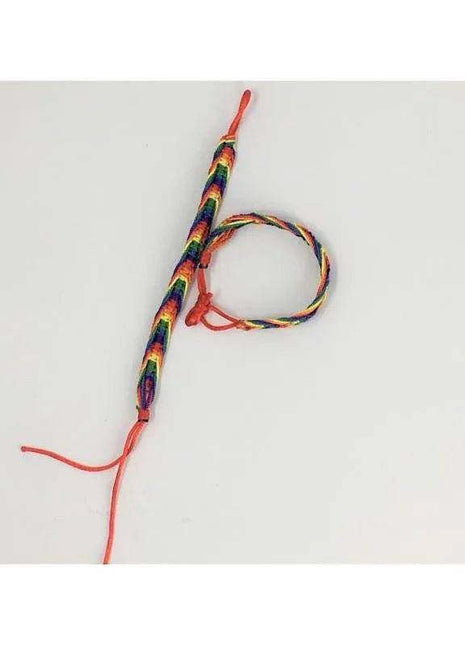 LGBT+ Pride Bracelet woven from multicoloured rainbow threads, with a braided band and adjustable red tie cords