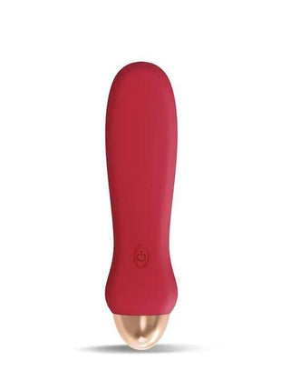 Luxo Stimulator in deep red with a smooth, tapered body, rounded tip, and gold-toned base