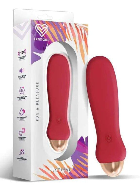 Luxo Stimulator with a smooth rust-red body, rounded ergonomic shape and rose-gold accent at the base