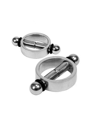 magnetic nipple clamps in polished silver metal, featuring circular open frames, central bars and rounded end knobs