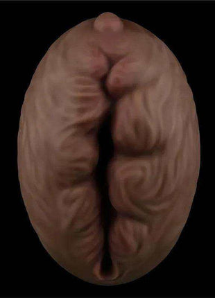 Masturbator Aliens Pie 3 in brown soft material, with a rounded oval shape and deeply ridged, sculpted texture