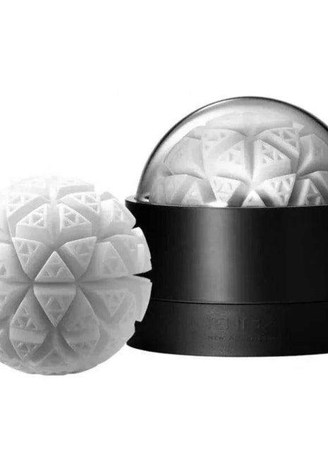 Masturbator Geo Glacier with a black cylindrical base, clear domed top, and white geometric textured insert