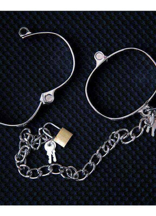 Metal Ankle Cuff for Women in silver-toned metal, with an open circular band and dangling chain, key and lock charms