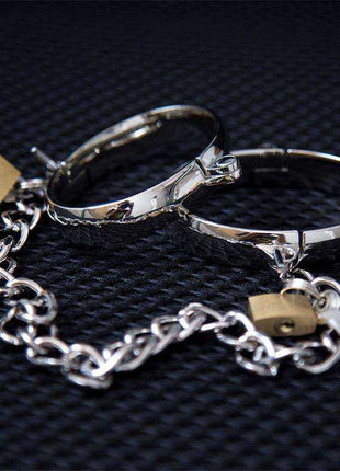 Metal Hand Cuff for Men 7cm in polished silver-tone metal, featuring two linked circular cuffs and a chain with small gold-tone locks