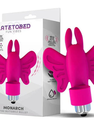 Monarch Butterfly Vibrating Bullet in bright pink silicone, with raised butterfly wings and a metallic base beside its box