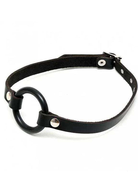 Mouthgag with O-Ring featuring a black leather strap, large black ring, and silver metal studs and buckle.