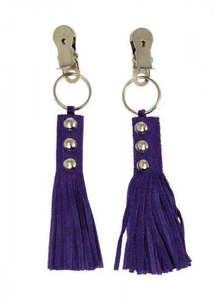 nipple clamps with silver metal clips, rings and studs attached to long purple suede-like tassels