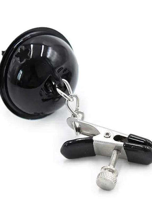 Nipple Clamps with Bell featuring a black mouth gag, silver chain and adjustable metal clamp with black tips.