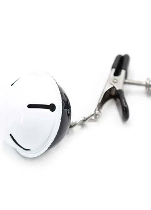 Nipple Clamps with Bell featuring a black-and-white spherical bell, silver metal chain and adjustable black-tipped clamp