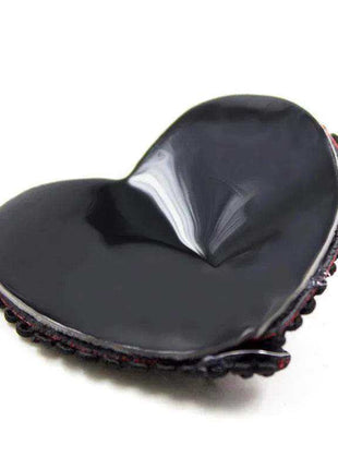 Nipple Covers with Lace Black/Red, a glossy black heart-shaped cover edged with black lace and subtle red accents