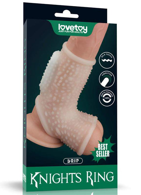 Penis and testicles sleeve in translucent pale pink silicone with raised nubs and a flexible ribbed ring, shown on its box