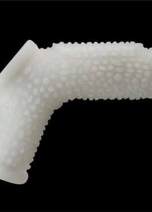 Penis and testicles sleeve in translucent white silicone with a flexible angled shape and raised textured bumps