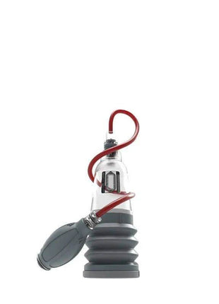 Penis Pump Hydroxtreme3 with a grey ribbed cylinder, hand pump, clear connector and red tubing.