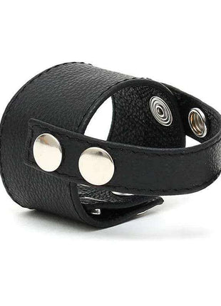 Penis Strap Adjustable black textured strap with a wraparound band, two silver snaps and multiple adjustment holes