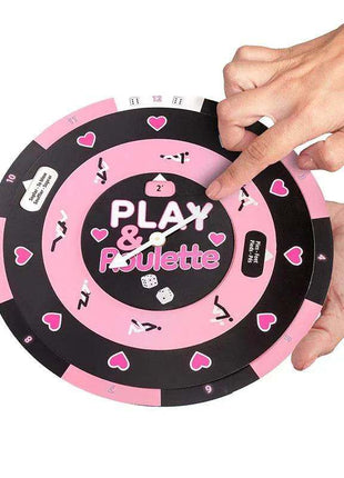 Play & Roulette game wheel with a pink and black circular design, white lettering, heart symbols and number markings