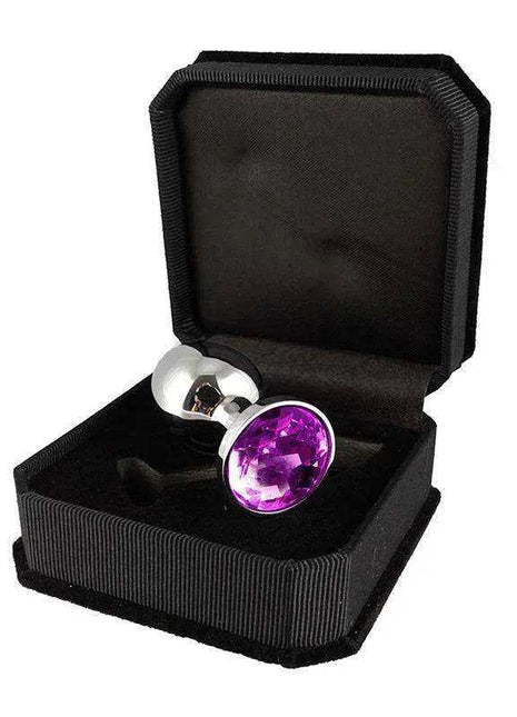Plug Metal 7,3 cm with a polished silver-toned metal base and a large round purple gemstone in a black case