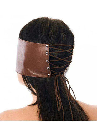 Premium Blindfold in brown leather with a wide eye-covering band, metal eyelets and crisscross lacing at the back