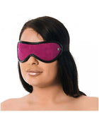 Premium Blindfold in bright magenta fabric with black trim, contoured eye shape, and a small metal side detail.