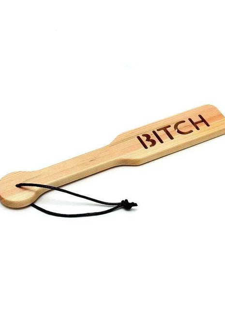 Premium Wooden Paddle in pale natural wood with rounded handle, black cord loop and engraved lettering