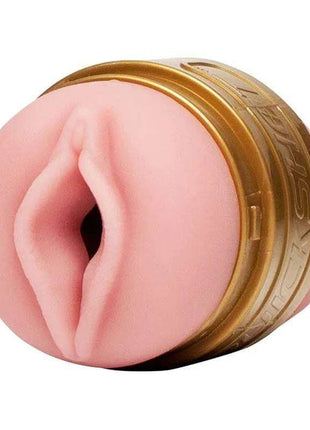 Quickshot Stamina Training Unit with a pink realistic textured opening and a metallic gold engraved outer ring