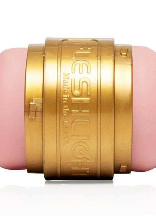 Quickshot Stamina Training Unit with a soft pink body and gold metallic central band embossed with branding