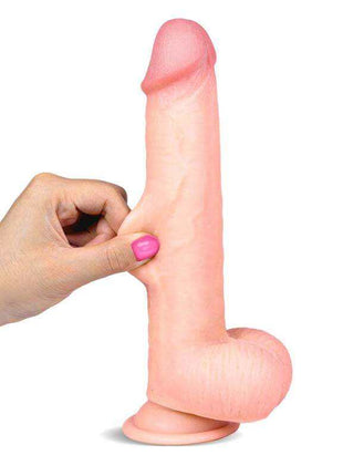 Realistic Dildo in pale pink dual-layer TPE, with a rounded tip, textured shaft, molded testicles and suction cup base