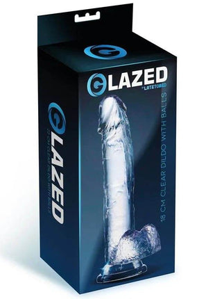 Realistic Dildo with Testicles in clear silicone, shown on its black and blue package with textured shaft and rounded base.